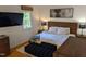 Spacious bedroom with a king-size bed and wood dresser at 1408 Brigham Rd, Chapel Hill, NC 27517