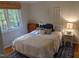 Cozy bedroom with a queen-size bed and ample natural light at 1408 Brigham Rd, Chapel Hill, NC 27517