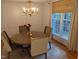 Bright dining room with hardwood floors and a chandelier at 1408 Brigham Rd, Chapel Hill, NC 27517