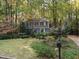 Gray house with white trim and a landscaped yard at 1408 Brigham Rd, Chapel Hill, NC 27517
