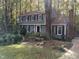 Two-story gray house with white trim, surrounded by trees at 1408 Brigham Rd, Chapel Hill, NC 27517