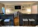 Stylish home bar featuring a mini-fridge and ample storage at 1408 Brigham Rd, Chapel Hill, NC 27517