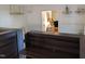 Modern home bar with dark wood shelving and built-in wine glass holders at 1408 Brigham Rd, Chapel Hill, NC 27517