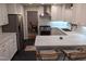 Updated kitchen featuring white cabinets, marble, and stainless steel appliances at 1408 Brigham Rd, Chapel Hill, NC 27517