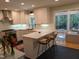 Modern kitchen with white cabinets and marble countertops at 1408 Brigham Rd, Chapel Hill, NC 27517