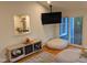 Sunroom features a wall-mounted TV and access to backyard at 1408 Brigham Rd, Chapel Hill, NC 27517