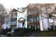 Two-story condo building with multiple balconies and landscaping at 1511 Creekwood Ct # 102, Raleigh, NC 27603