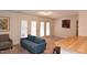 Living room with couches, a TV, and access to a patio at 1511 Creekwood Ct # 102, Raleigh, NC 27603