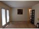 Bright living room with access to patio and neutral decor at 1511 Creekwood Ct # 102, Raleigh, NC 27603