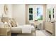 Spacious bedroom with light wood furniture and built-in desk at 1540 Goldfinch Perch Ln, Knightdale, NC 27545