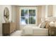 Serene bedroom with dresser and window seat at 1540 Goldfinch Perch Ln, Knightdale, NC 27545