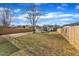 Spacious backyard with a large lawn, gazebo, and wooden fence at 1605 Thompson St, Raleigh, NC 27603