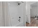 Updated bathroom with a shower/tub combo and modern fixtures at 1608 Overlook Ct, Sanford, NC 27332