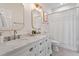 Bathroom with double vanity, marble countertop, and bathtub at 1724 Bowling Green Trl, Raleigh, NC 27613