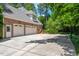 Three-car garage with large concrete driveway at 1724 Bowling Green Trl, Raleigh, NC 27613