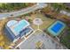 Aerial view of the community amenities showcasing the pool, tennis court and playground at 200 Callandale Ln, Durham, NC 27703