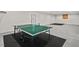 Finished basement offers versatile space with ping pong table and outside access at 200 Callandale Ln, Durham, NC 27703
