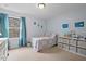 Bright bedroom with a comfortable bed, natural light, and charming décor at 200 Callandale Ln, Durham, NC 27703
