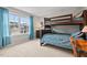 Comfortable bedroom featuring a bunk bed, wooden desk, and bright window with a neighborhood view at 200 Callandale Ln, Durham, NC 27703