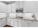 Modern kitchen features granite countertops, stainless steel appliances, and white cabinets at 200 Callandale Ln, Durham, NC 27703