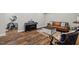 Cozy living room with a sofa, coffee table, piano, and home gym at 200 Callandale Ln, Durham, NC 27703