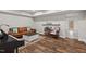 Cozy living room with a leather sofa, coffee table, piano, and access to the outdoors at 200 Callandale Ln, Durham, NC 27703