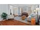 Inviting living room with hardwood floors, comfortable seating, and large windows at 200 Callandale Ln, Durham, NC 27703