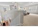 Upstairs living room with carpet, neutral walls, and stairway access at 200 Callandale Ln, Durham, NC 27703