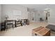 Spacious living room with neutral walls, comfortable seating, and multiple doorways leading to other rooms at 200 Callandale Ln, Durham, NC 27703