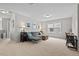 Spacious loft area with comfortable seating, desk, and natural light from the window at 200 Callandale Ln, Durham, NC 27703