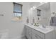 Double vanity bathroom with modern fixtures at 2017 Tulip Spring Dr, Zebulon, NC 27597