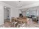 Bright dining room with chandelier and views to the living room at 2017 Tulip Spring Dr, Zebulon, NC 27597