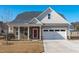 Craftsman style home with stone accents and a two-car garage at 2017 Tulip Spring Dr, Zebulon, NC 27597