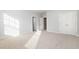 Secondary bedroom with neutral walls, carpet, and ample closet space at 203 Shale Creek Dr, Durham, NC 27703