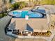 Aerial view of community pool, clubhouse, and surrounding landscape at 203 Shale Creek Dr, Durham, NC 27703