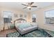 Main bedroom with a large bed, two windows and stylish decor at 206 Maple Walk St, Durham, NC 27703