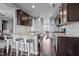 Modern kitchen with island, granite counters, and dark cabinets at 222 Sapphire Rd, Burlington, NC 27215