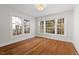 Spacious bedroom with hardwood floors and large windows at 2419 Highland Ave, Durham, NC 27704