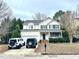 Charming two-story home with a manicured lawn and attached two car garage on a tree-lined street at 2421 Barton Oaks Dr, Raleigh, NC 27614