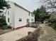 Home's exterior showcasing the deck and patio area at 2421 Barton Oaks Drive, Raleigh, NC 27614