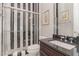 Modern bathroom with black and white striped shower and vanity at 2421 Beckwith Rd, Apex, NC 27523