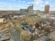 Wider aerial showcasing the property and city skyline at 243 New Bern Pl # 301, Raleigh, NC 27601