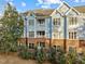 Multi-unit building, brick exterior, and attractive landscaping at 243 New Bern Pl # 301, Raleigh, NC 27601