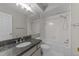 Bathroom with granite vanity and shower/tub combo at 243 New Bern Pl # 301, Raleigh, NC 27601