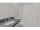 Clean bathroom with granite vanity, bathtub, and shower at 243 New Bern Pl # 301, Raleigh, NC 27601