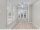 Bright bedroom with large windows and ceiling fan at 243 New Bern Pl # 301, Raleigh, NC 27601