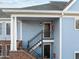 Exterior view of building with stairs and two entrances at 243 New Bern Pl # 301, Raleigh, NC 27601
