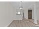 Dining area with hardwood floors and kitchen access at 243 New Bern Pl # 301, Raleigh, NC 27601