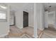 Modern entryway with hardwood floors, columns and kitchen view at 243 New Bern Pl # 301, Raleigh, NC 27601