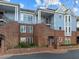 Brick building with blue accents, multiple units, and a charming facade at 243 New Bern Pl # 301, Raleigh, NC 27601
